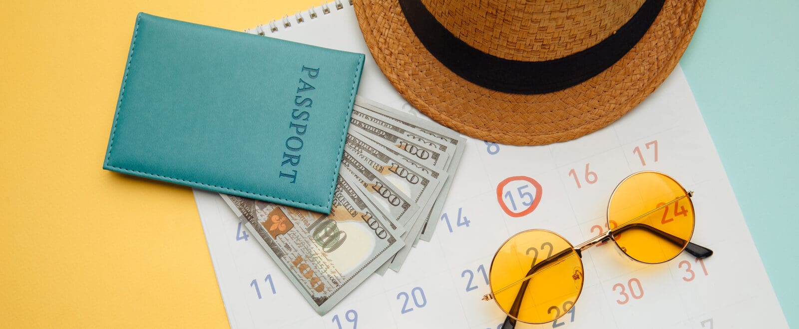 Summer Calendar Schedule with travel accessorises on blue yellow background. Travel, tourism, holiday concept.