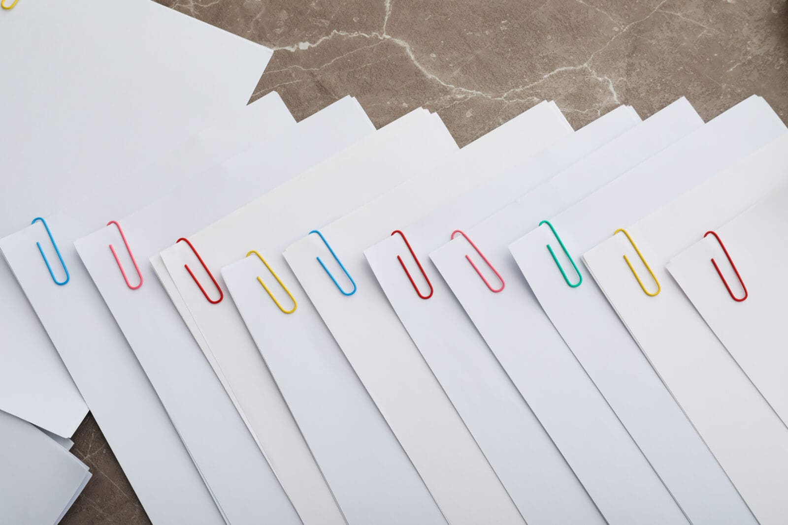 Concept of different office accessories - paper with clip