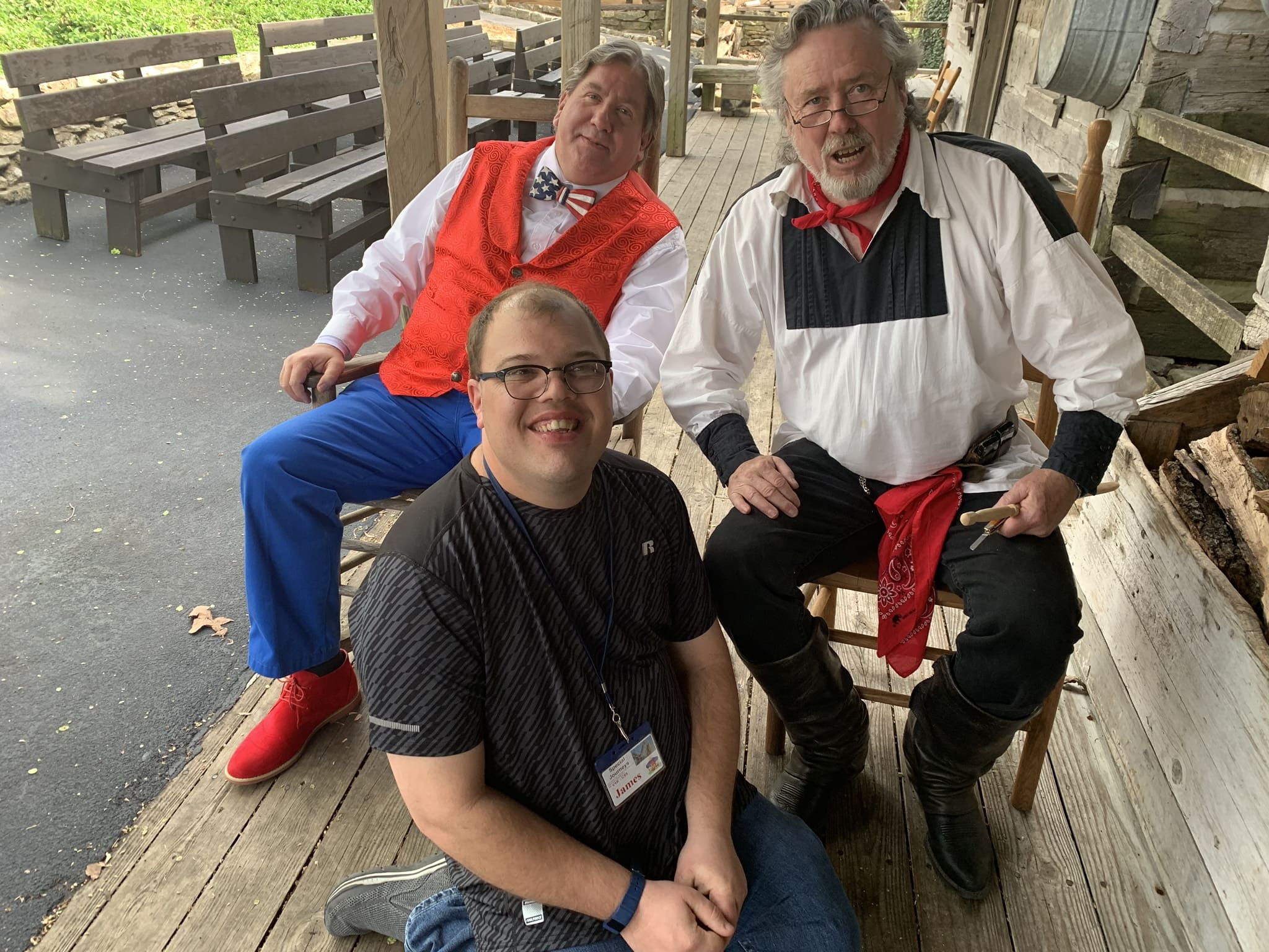 Smiling tourist posing with performers in Branson | Special Journeys | Special Needs Travel Program for Adults